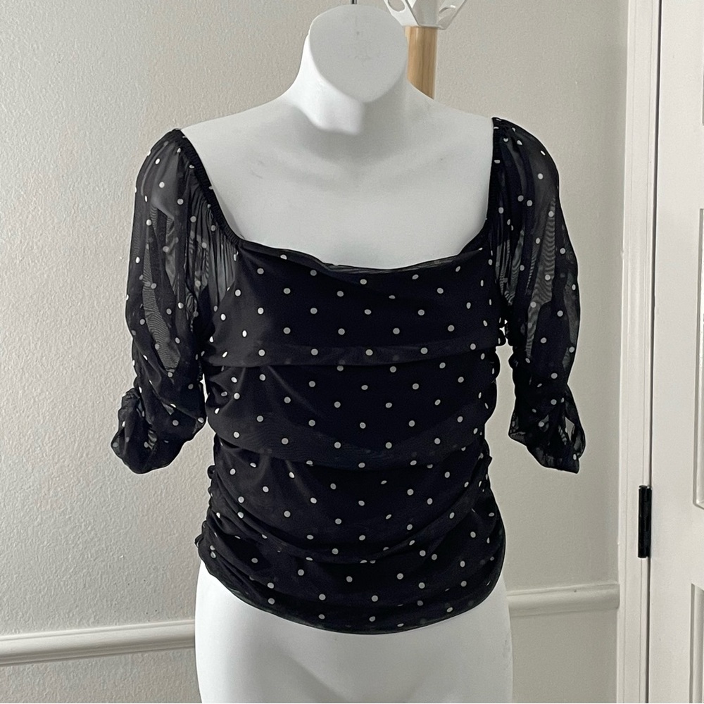 Anthropologie Shirred Mesh Top with a black and white polka dot pattern